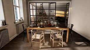a dining room table with chairs and a christmas tree