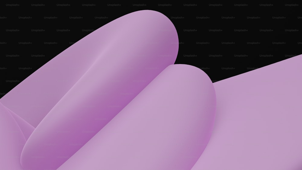 Un primer plano de un objeto púrpura sobre un fondo negro