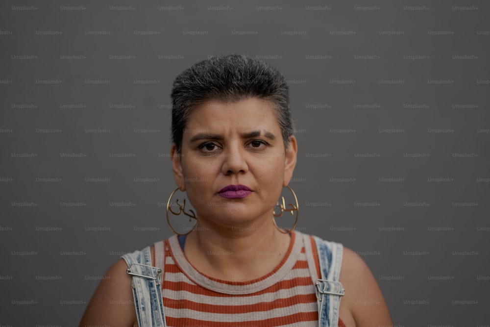 a woman in overalls with a surprised look on her face