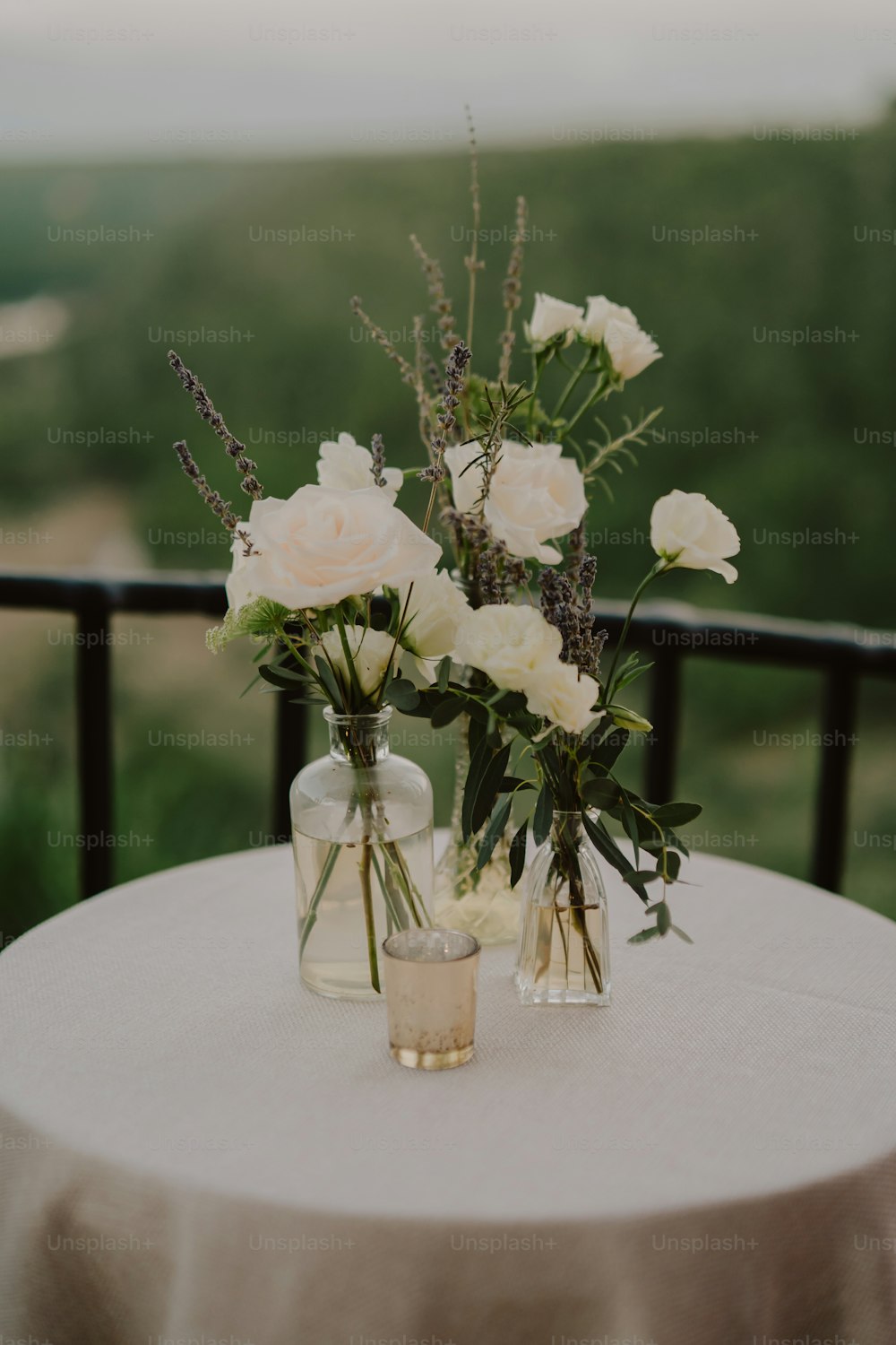 two vases filled with flowers on top of a table