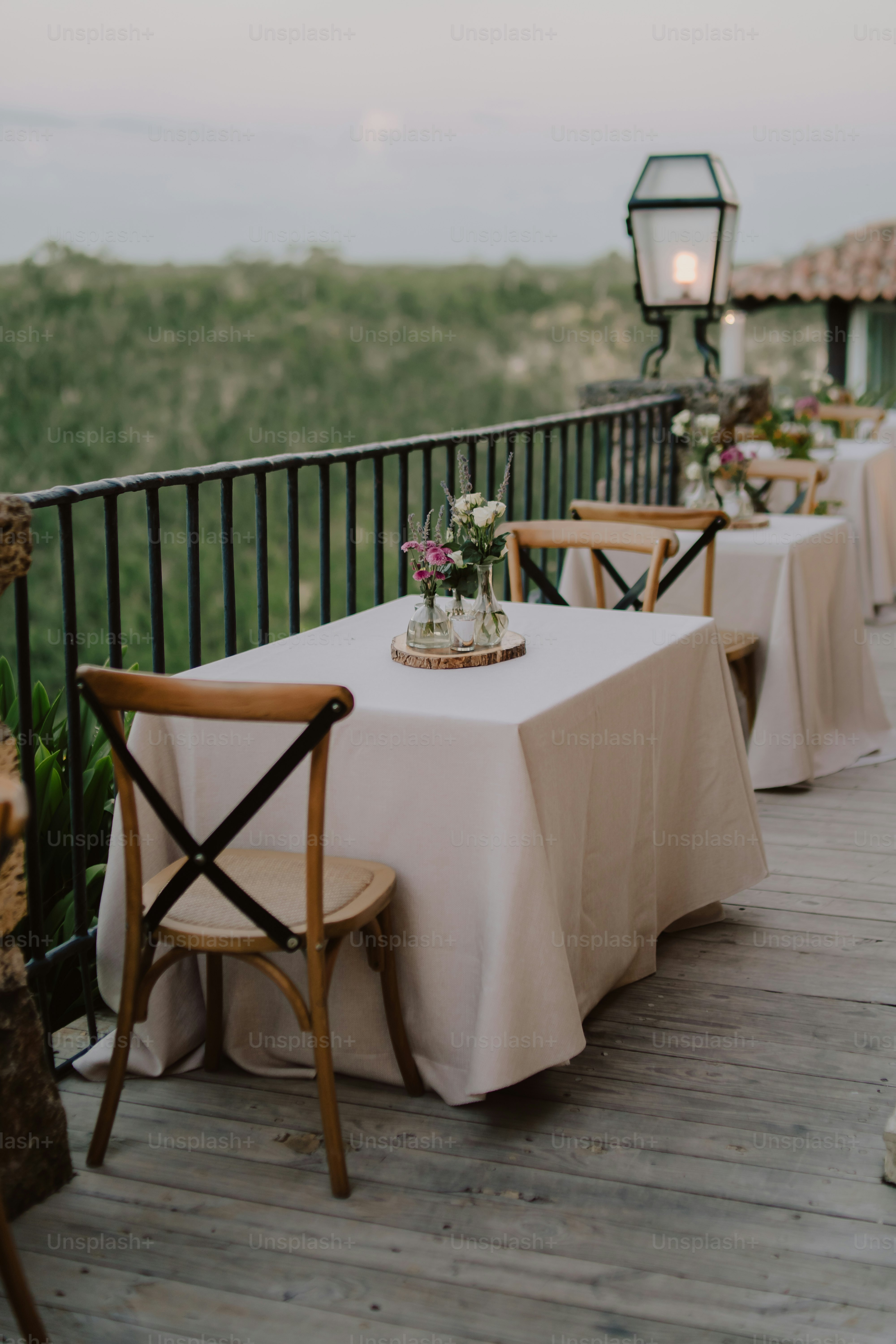 a couple of chairs sitting on top of a wooden deck