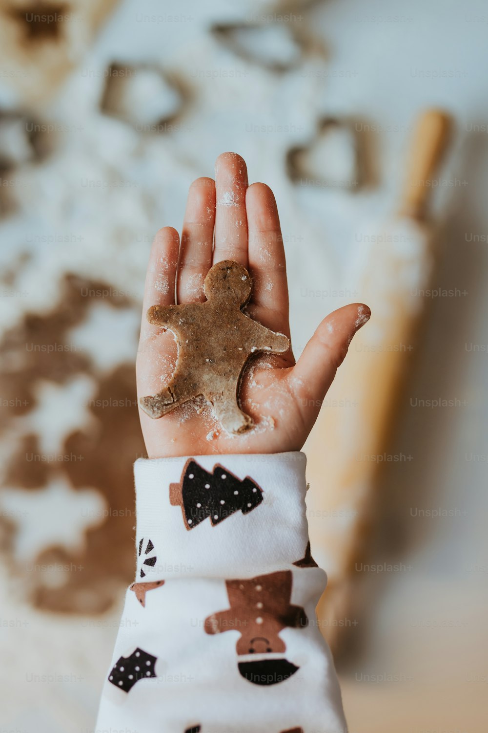 a hand holding a piece of food in it's palm