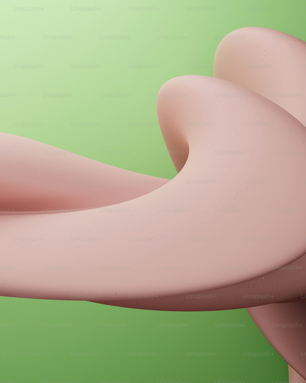 a close up of a pink object on a green background