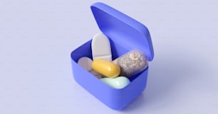 a blue container filled with different types of pills