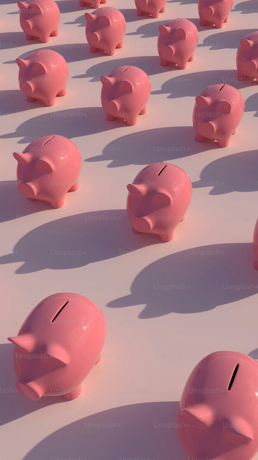 a group of pink piggy banks sitting on top of each other