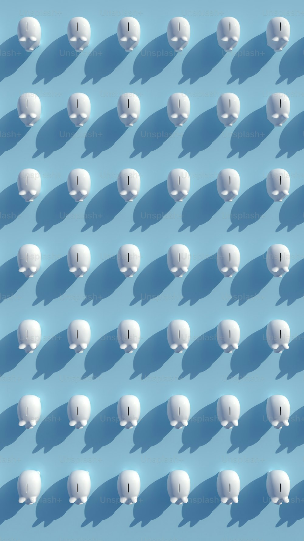 a large group of white objects on a blue background