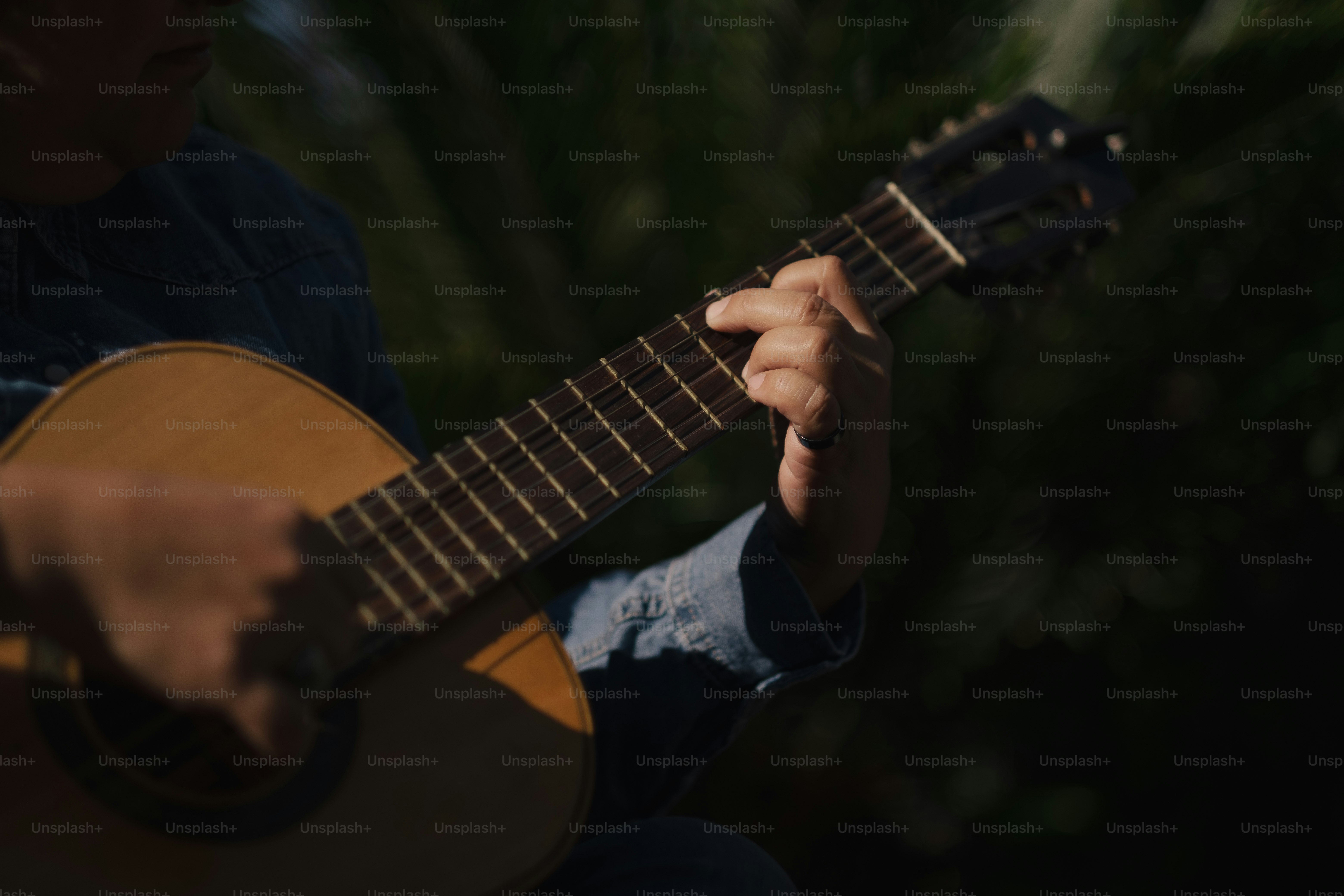 Adriana strumming her guitar.