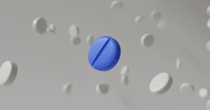 a blue object floating in the air surrounded by white circles