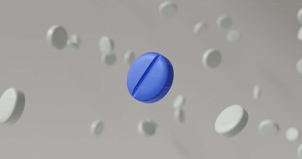 Un oggetto blu che fluttua nell'aria circondato da cerchi bianchi