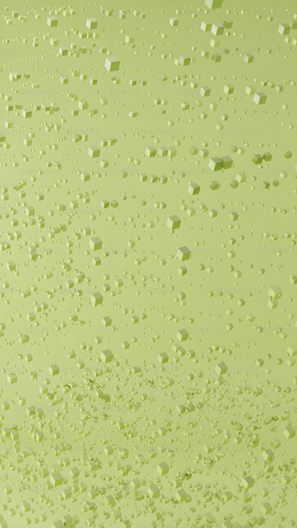 a close up of water droplets on a green surface