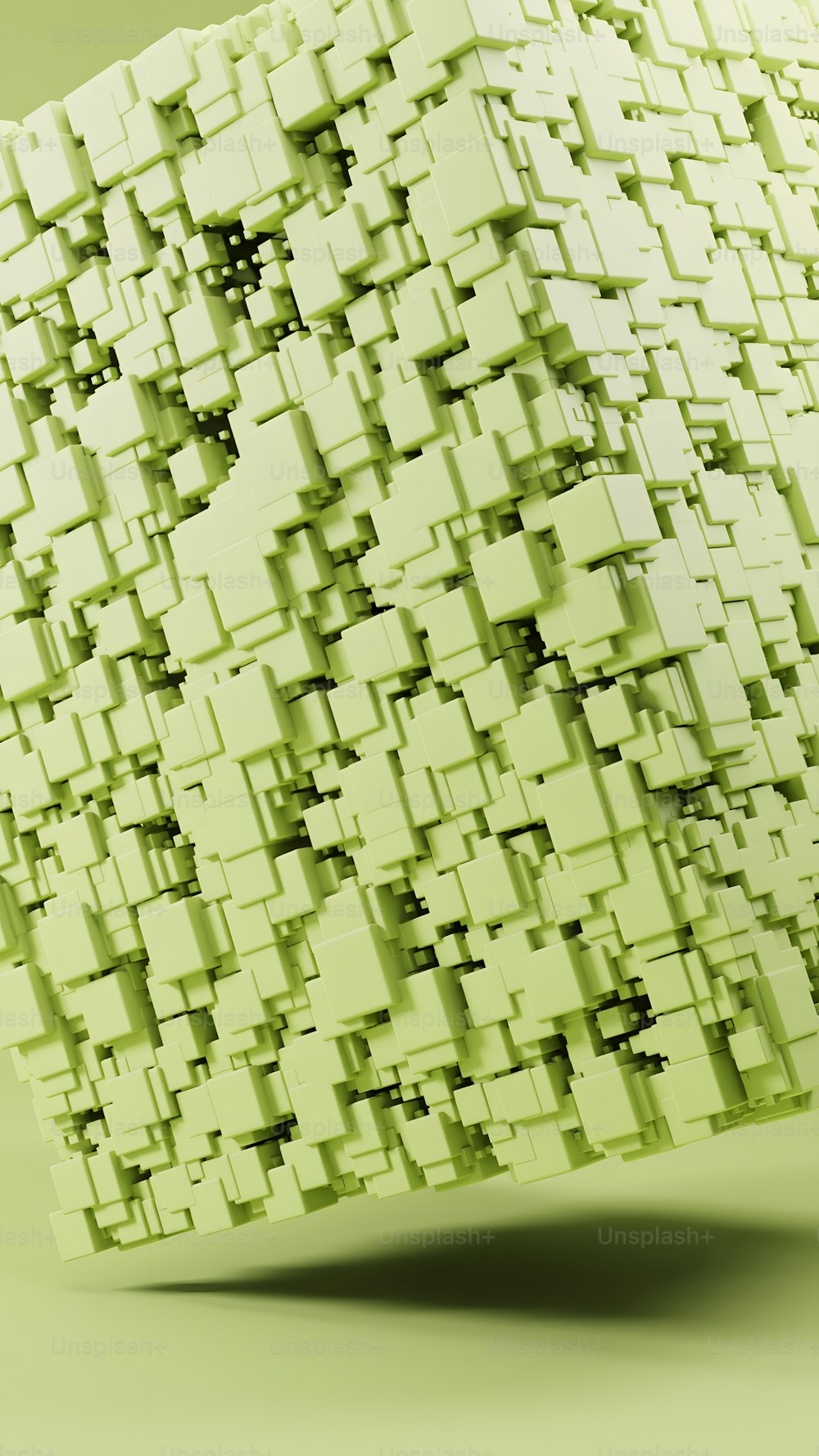 a green cube with many smaller squares on it