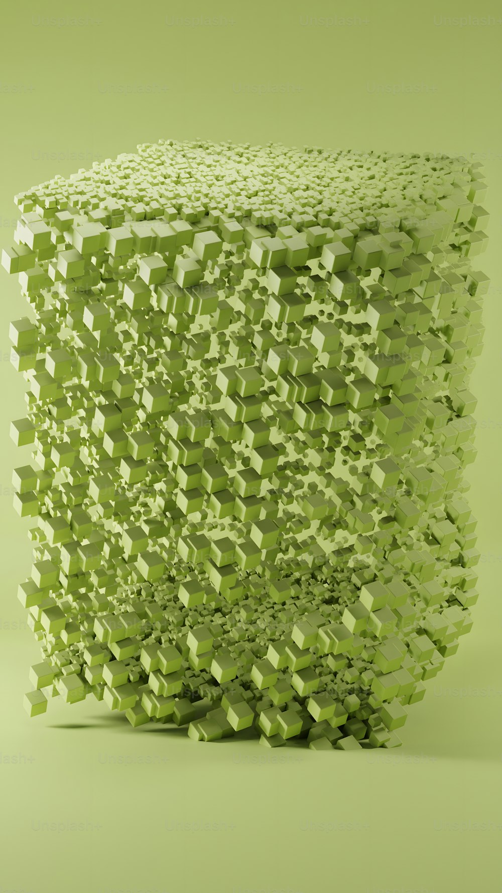 une sculpture faite de cubes verts sur fond vert