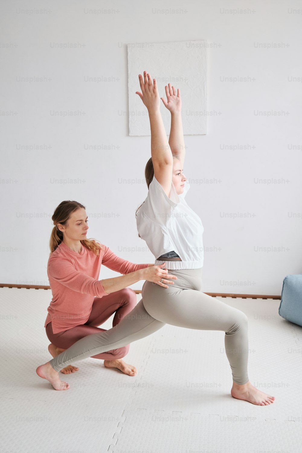 a man and a woman doing a yoga pose