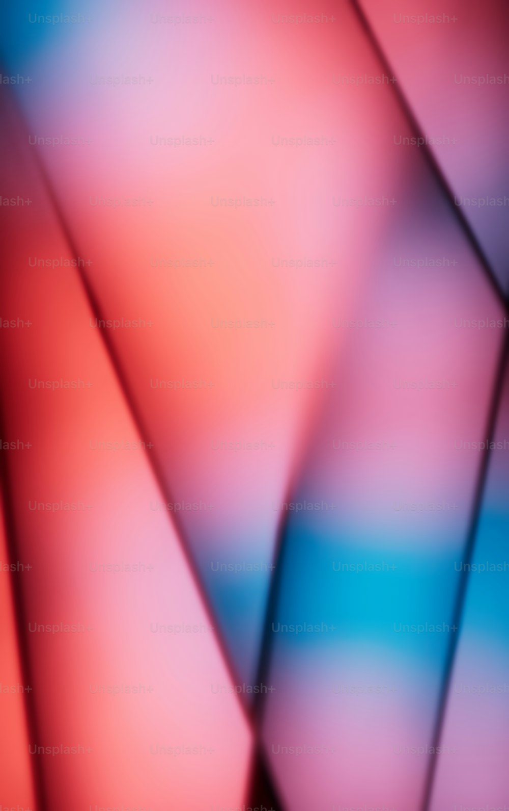 a blurry image of a red and blue background