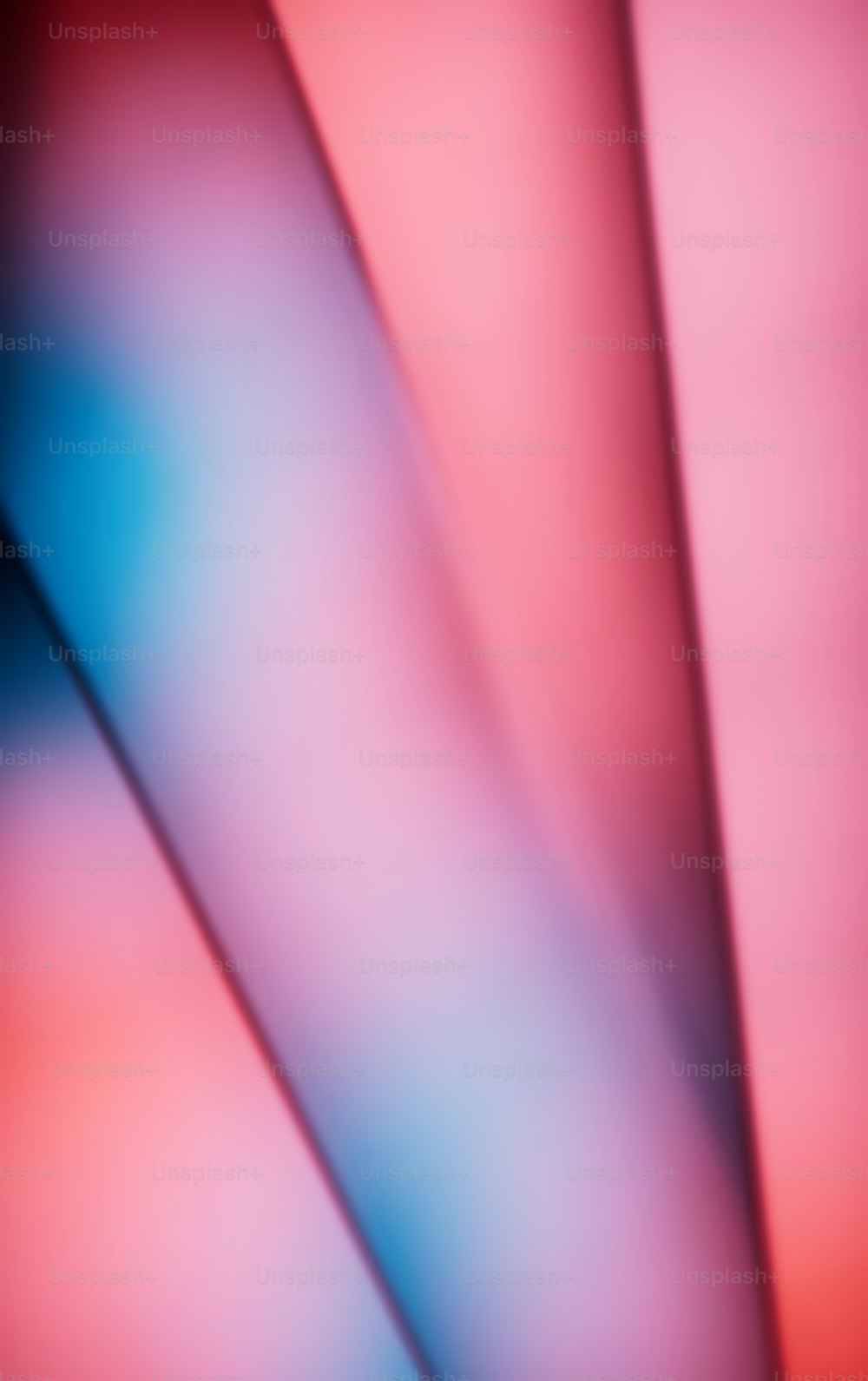 a blurry image of a red and blue background