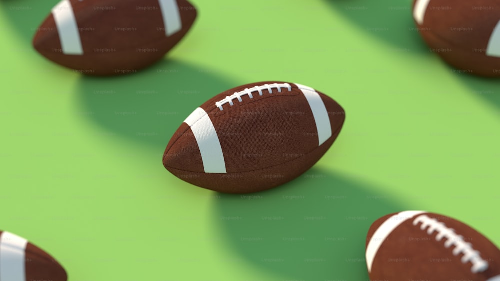 a close up of a football on a green surface