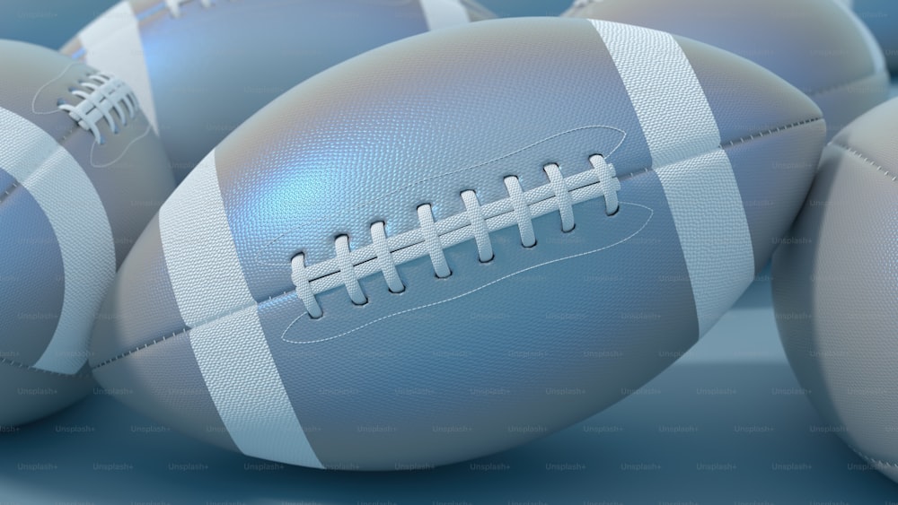 a close up of a bunch of footballs