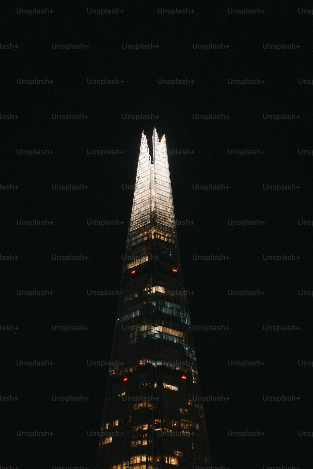 a very tall building lit up at night