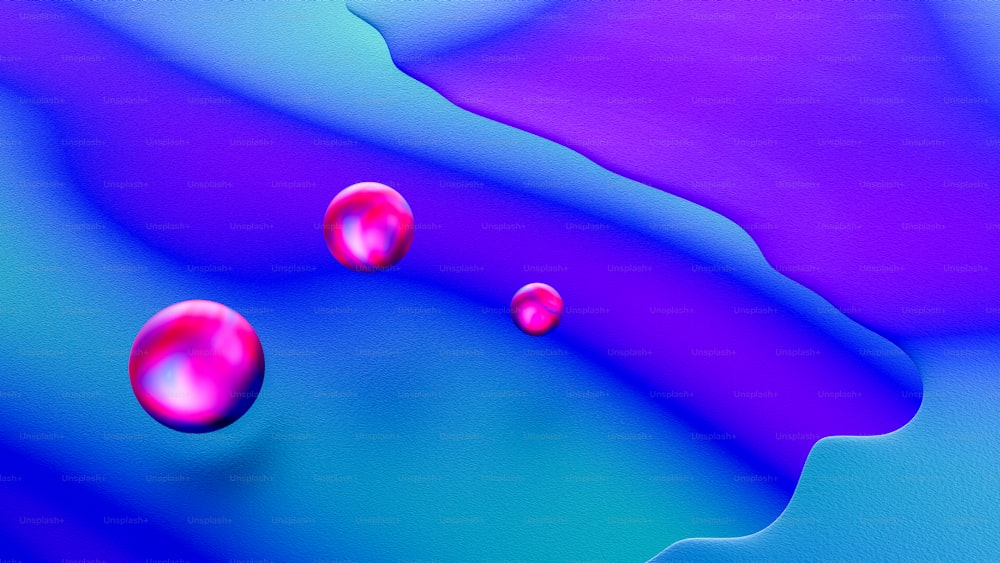 파란색과 보라색 액체에 떠 있는 세 ��개의 빨간 공
