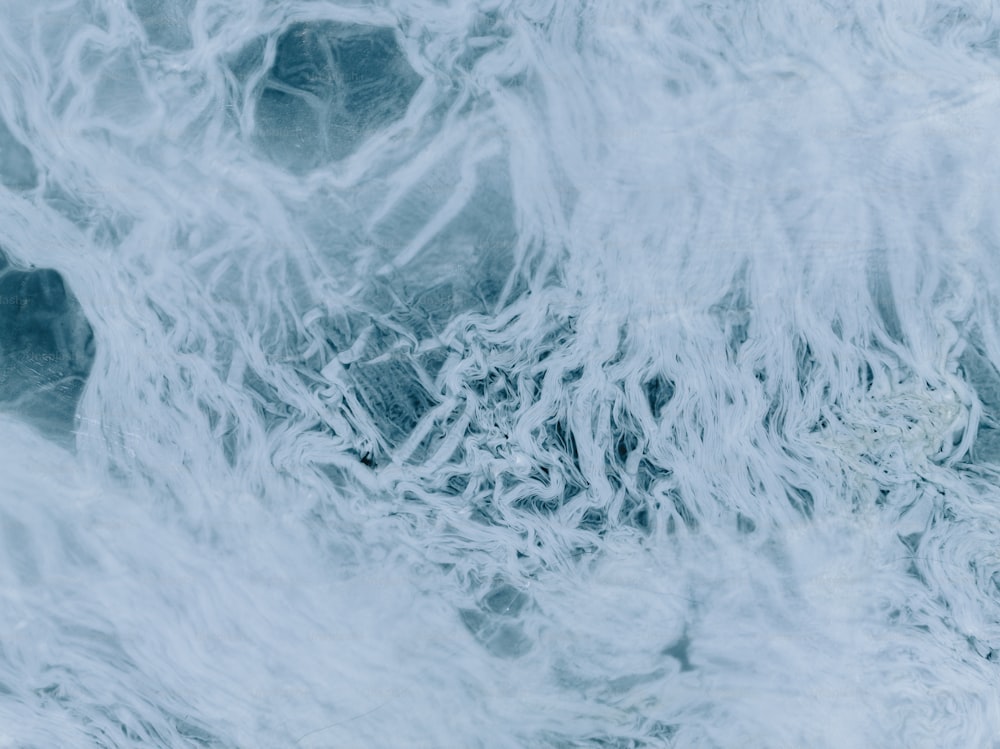 an aerial view of a blue and white background