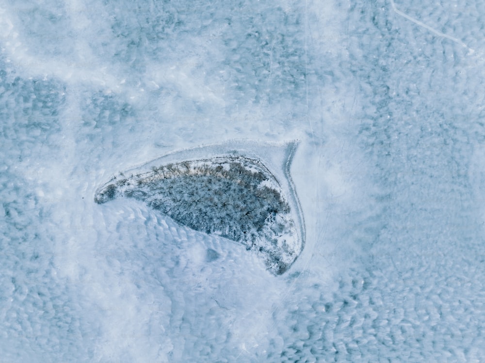 an aerial view of a snow covered area