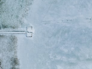 an aerial view of a road in the snow