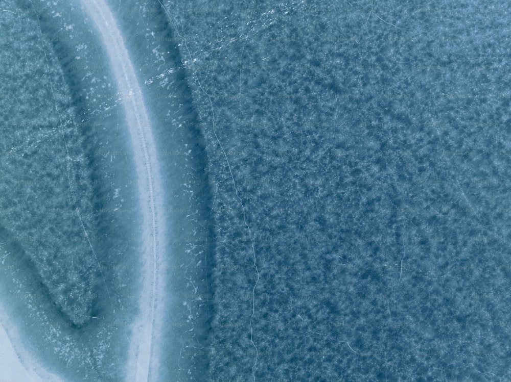 an aerial view of a snow covered field