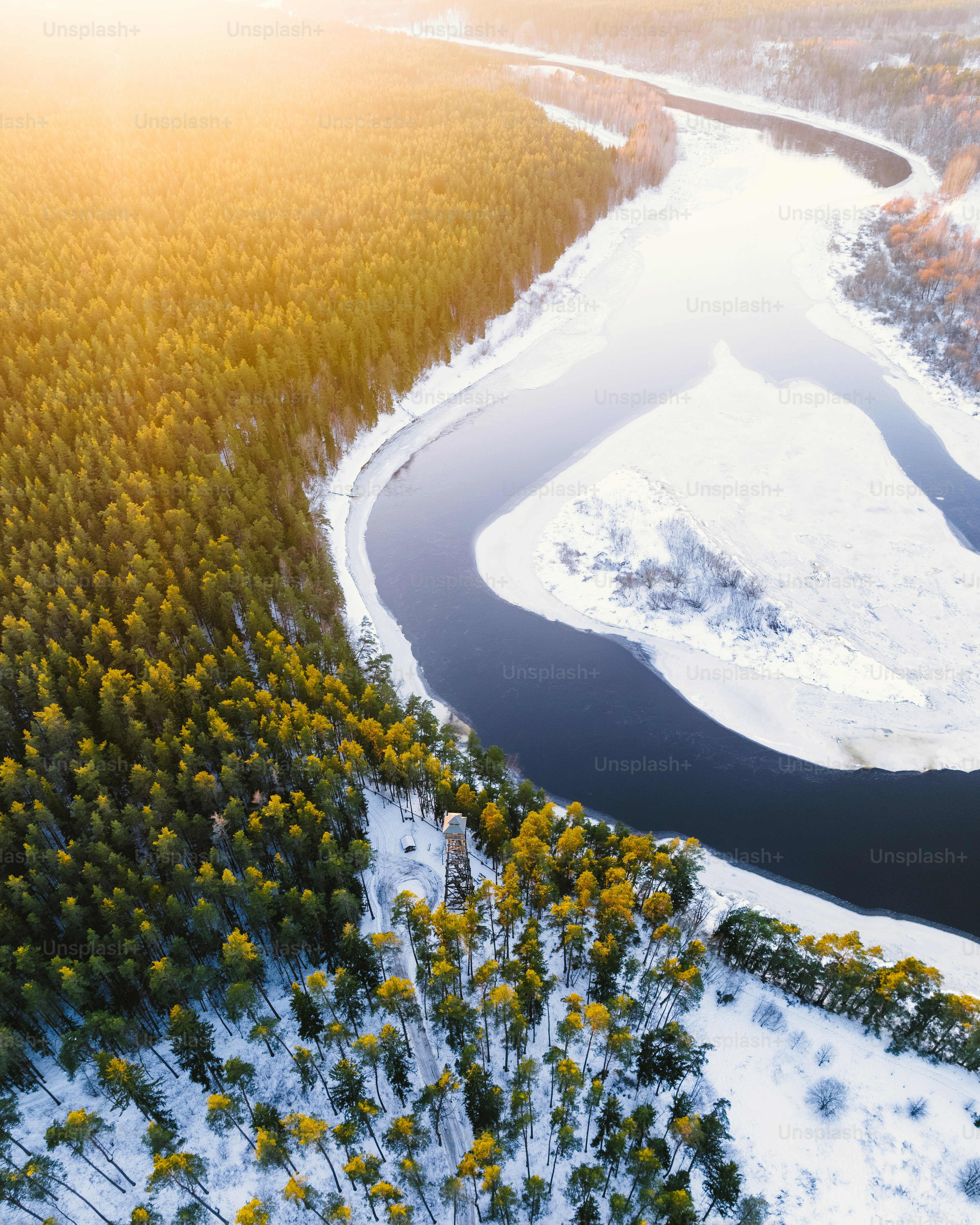 a river running through a snow covered forest