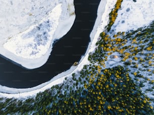 a river running through a snow covered forest