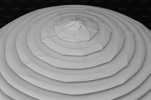 un objet circulaire blanc avec un fond noir