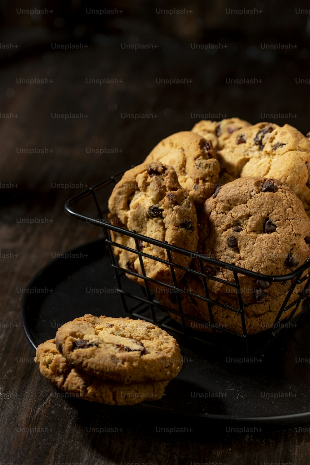 a basket of cookies sitting on top of a black plate