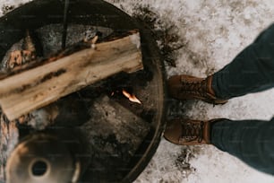 a person standing in front of a fire pit
