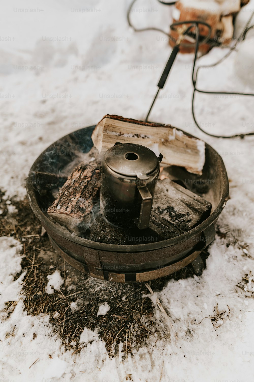 a stove that is sitting in the snow