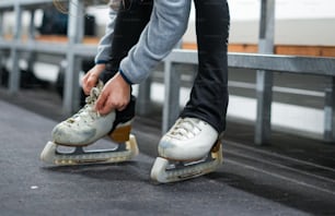 a person on a skateboard tying up their shoes