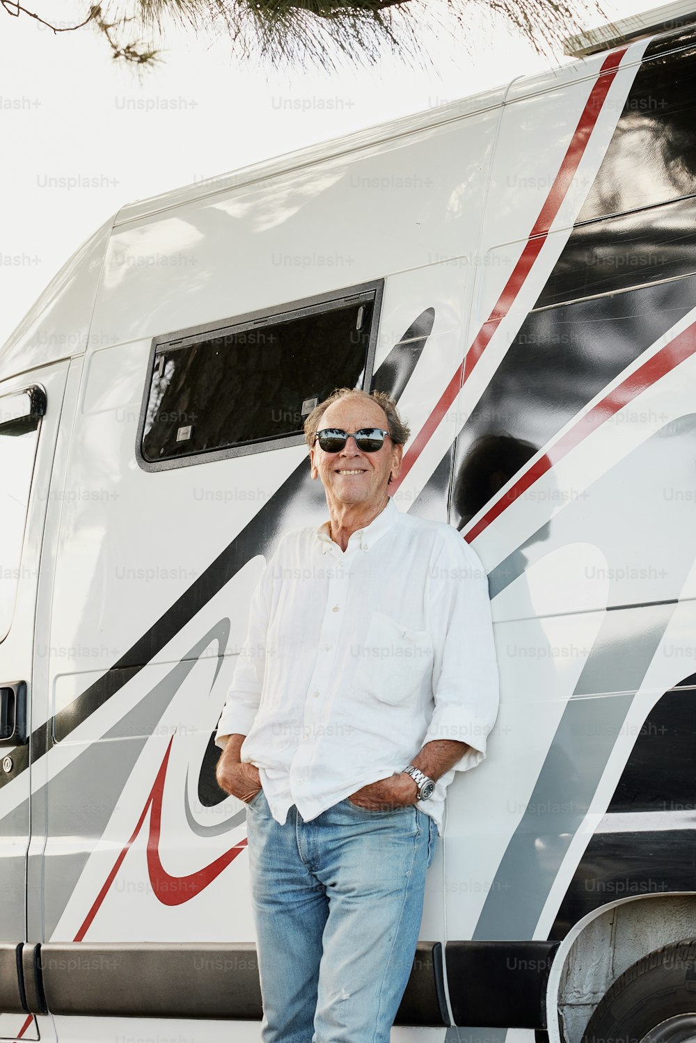 a man standing in front of a motor home