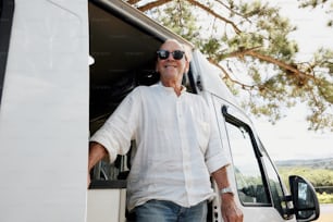 a man standing in the doorway of a truck