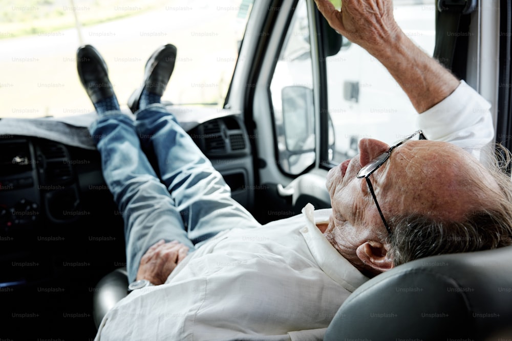 a man laying in the back of a truck