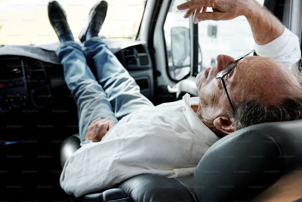 a man laying in the back of a truck