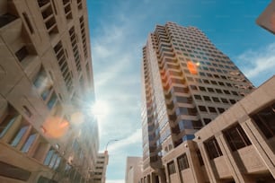 a couple of tall buildings sitting next to each other