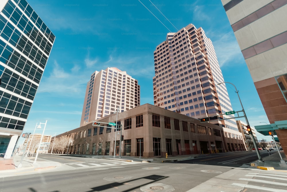 a city street with tall buildings in the background