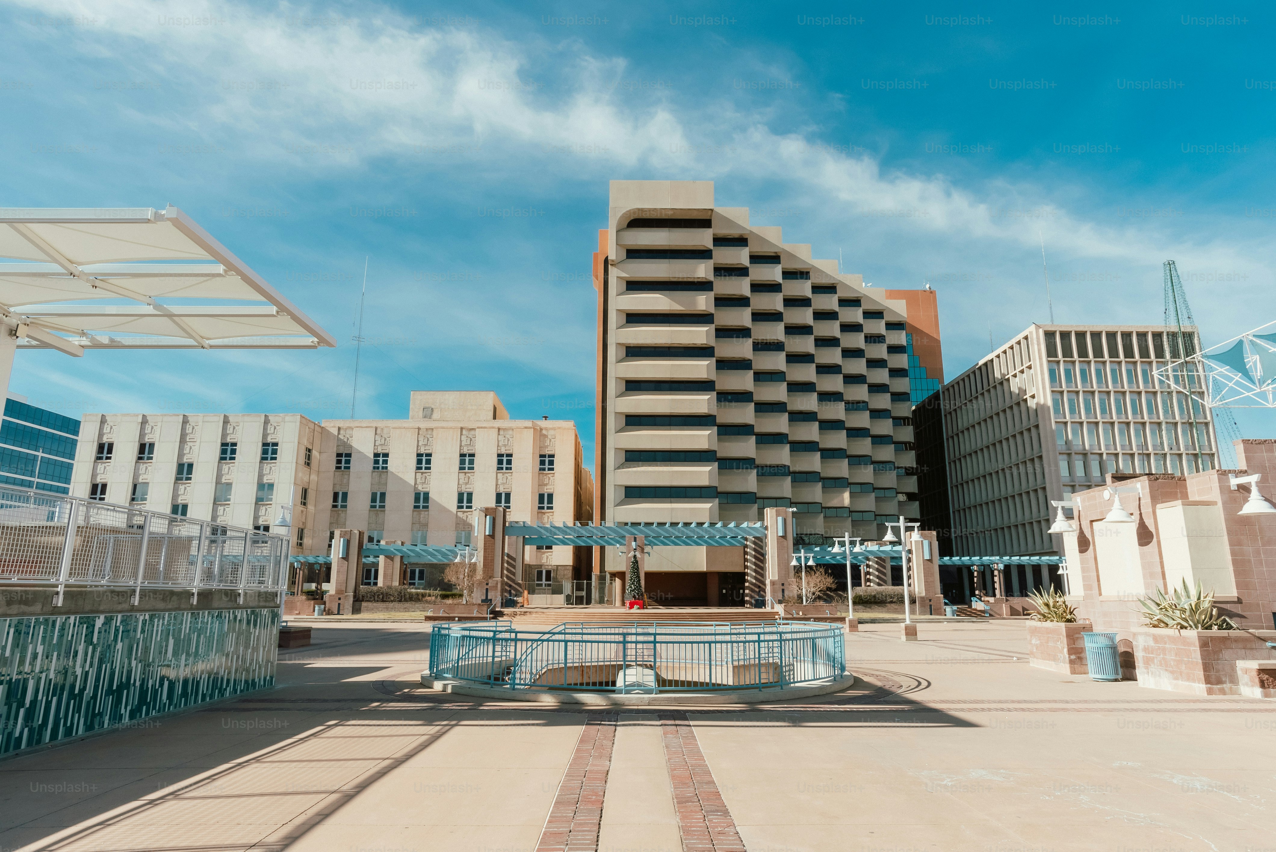 a large building with a fountain in front of it