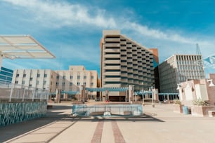 a large building with a fountain in front of it