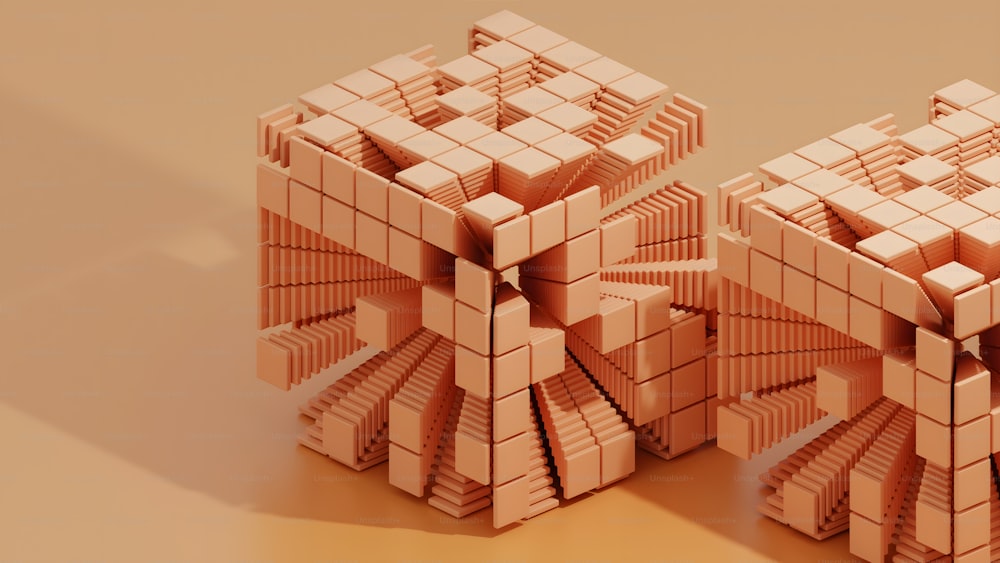 une paire de cubes roses assis sur une table