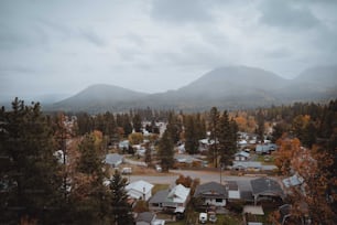 a view of a town with mountains in the background