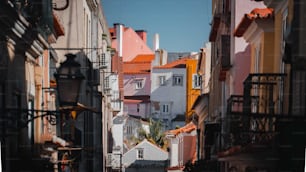 a narrow street with a clock tower in the distance