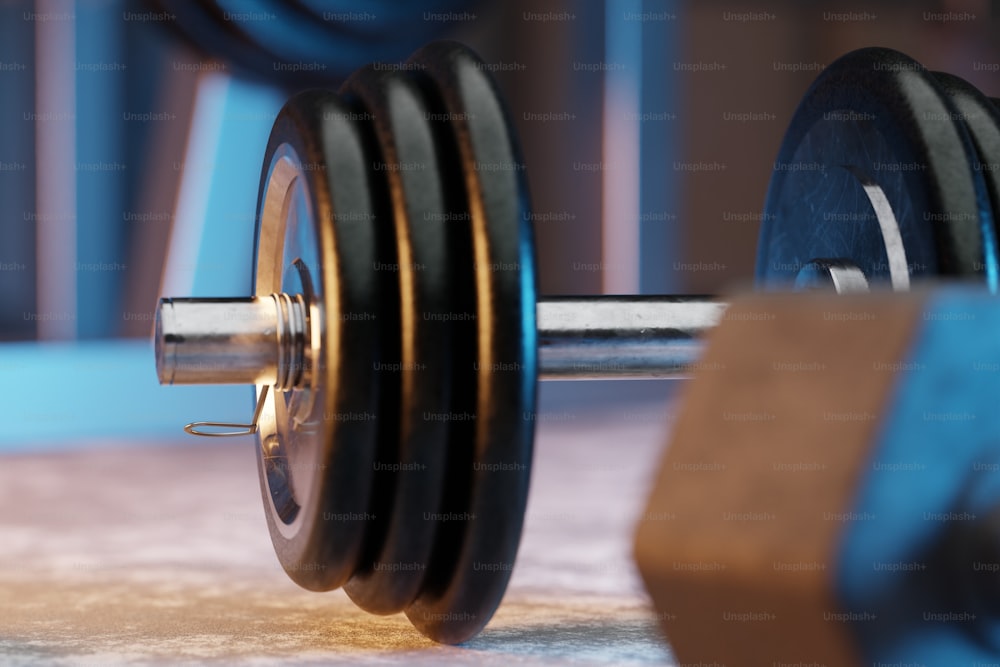 a close up of a barbell in a gym