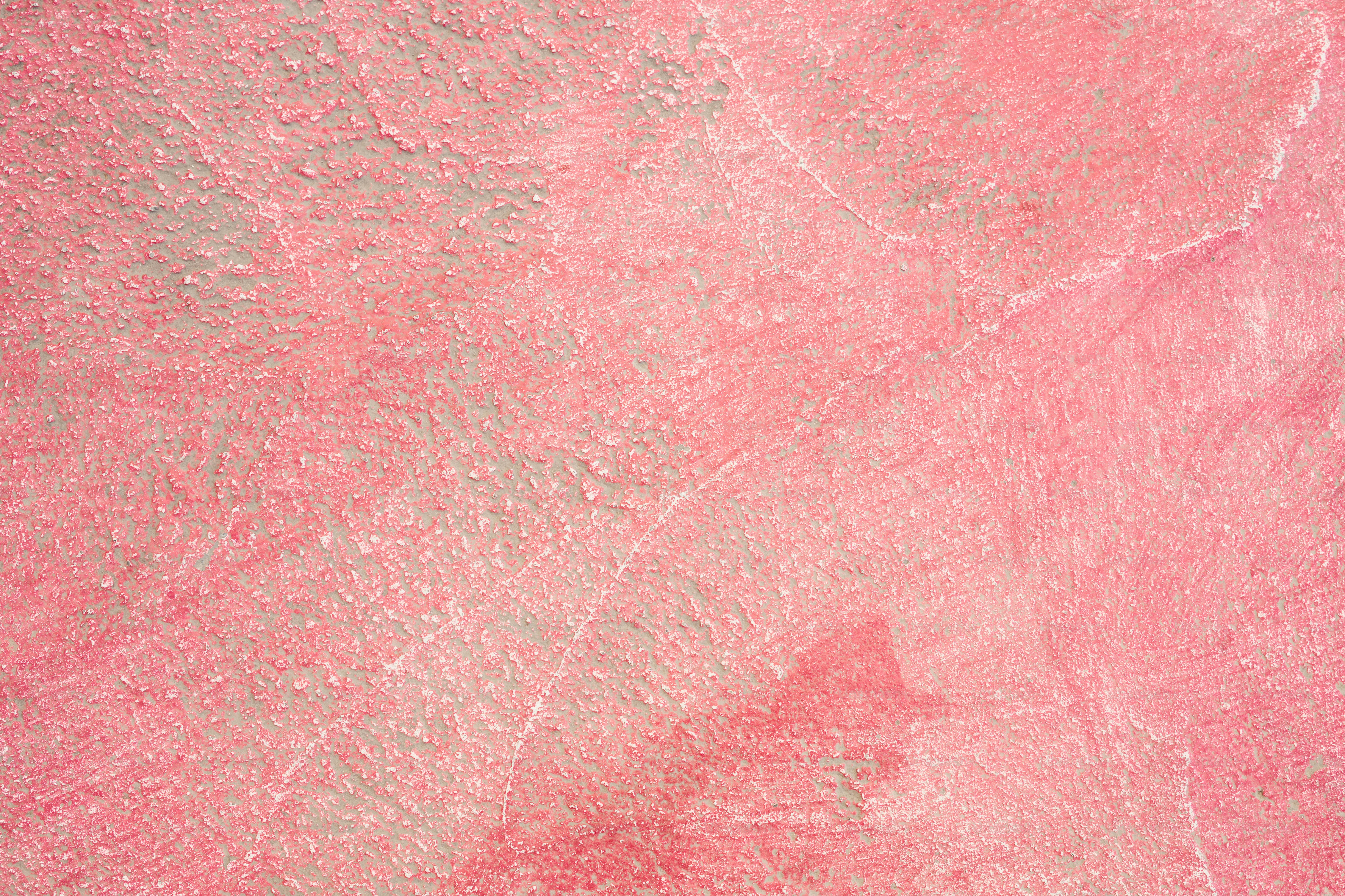 eine Nahaufnahme einer rosa und grauen Oberfläche