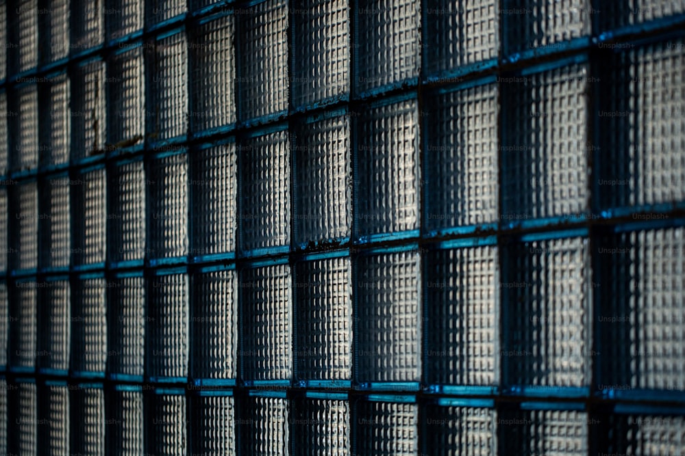 a close up of a wall made of metal mesh