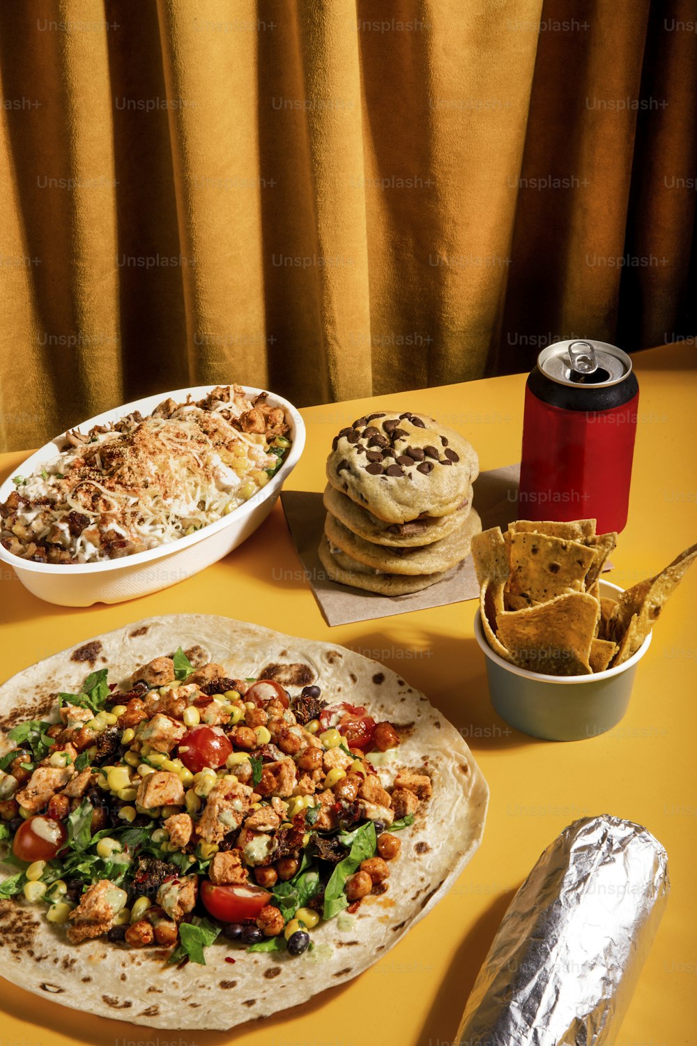 a table topped with a tortilla covered in lots of toppings