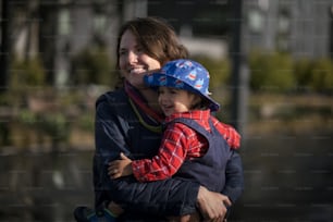 a woman holding a child in her arms